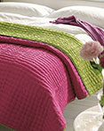 Chenevard Reversible Quilt Fuchsia & Lime by Designers Guild Bedding